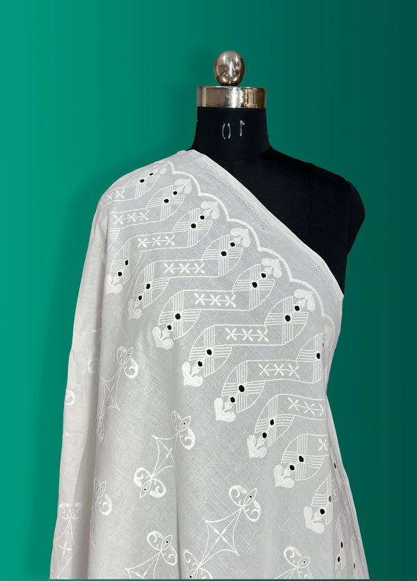 Geometrical border with all-over embroidery on cotton fabric.
