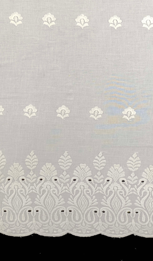 Floral border with all-over butti embroidery on cotton fabric.